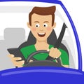 Young man using his smartphone behind the wheel. Problem addiction danger concept Royalty Free Stock Photo