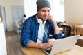 Young man using laptop at cafe Royalty Free Stock Photo