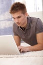 Young man using laptop computer Royalty Free Stock Photo