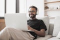 Young man using laptop computer at home, Student men resting in his room, working at home concept Royalty Free Stock Photo