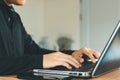 young man using laptop computer and mobile phone When looking for financial information in business Royalty Free Stock Photo