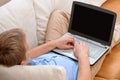 Young man using a laptop at home Royalty Free Stock Photo