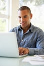 Young Man Using Laptop At Home Royalty Free Stock Photo