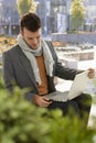 Young man using laptop in park Royalty Free Stock Photo