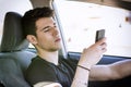 Young Man using mobile phone while driving Royalty Free Stock Photo