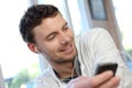 Young man using mobile phone Royalty Free Stock Photo