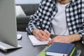 Young man using modern computer for studying at home, closeup. Distance learning Royalty Free Stock Photo