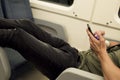 Young man using a smartphone in a train or subway Royalty Free Stock Photo