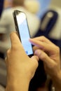 Young man using a smartphone in a train or a subway Royalty Free Stock Photo