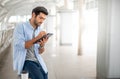 The young man using a tablet to working at out of office. The man wearing casual cloth and feeling thinking and seriously Royalty Free Stock Photo