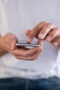 Young man using a touchscreen smartphone cell phone Royalty Free Stock Photo