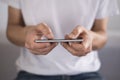 Young man using touchscreen smartphone horizontally. Concept for using technology, shopping online, using mobile apps, texting