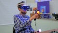 Young man using virtual reality glasses. VR Royalty Free Stock Photo