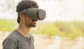 Young man using a VR headset glasses outside Royalty Free Stock Photo