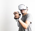 Young man using VR headset. Guy playing with VR glasses Royalty Free Stock Photo