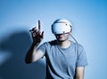 Young man using VR headset. Guy playing with VR glasses Royalty Free Stock Photo