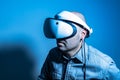 Young man using VR headset. Guy playing with VR glasses Royalty Free Stock Photo