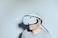 Young man using VR headset. Guy playing with VR glasses Royalty Free Stock Photo