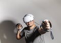 Young man using VR headset. Guy playing with VR glasses Royalty Free Stock Photo