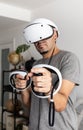 Young man using VR headset. Guy playing with VR glasses Royalty Free Stock Photo