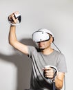 Young man using VR headset. Guy playing with VR glasses Royalty Free Stock Photo