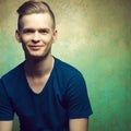 Young man with very handsome face in blue t-shirt Royalty Free Stock Photo