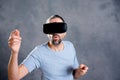 Man with virtual reality glasses pointing looking surprised Royalty Free Stock Photo