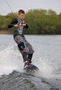 A young man wake-boarding Royalty Free Stock Photo