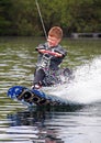 A young man wake-boarding Royalty Free Stock Photo