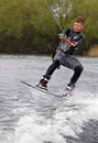 A young man wake-boarding Royalty Free Stock Photo