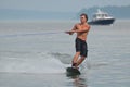 Young Man Wakeboarding in Maine with a Lobster Boat in the Background Royalty Free Stock Photo