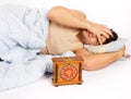 Young man wakes to a loud alarm clock Royalty Free Stock Photo
