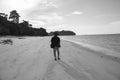 A young man walk around seaside beach at Mantanani Island