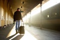 Young man walking with bag at train station Royalty Free Stock Photo