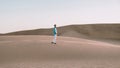 Young men walking at the beach of Maspalomas Gran Canaria Spain, men at the sand dunes desert Royalty Free Stock Photo