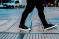 Young man walking down the sidewalk in a city Royalty Free Stock Photo