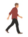 Young man walking. Handsome stylish guy side view.