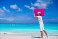 Young man walking with his bag on tropical white beach Royalty Free Stock Photo