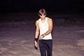 young man walking in tank top