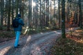 Young man walking on touristic path in misty morning fog forest. Czech landscape Royalty Free Stock Photo