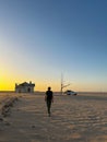 Young man walks at abandoned railway near Garub railroad station. Kolmanskop. Royalty Free Stock Photo