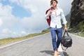 Young man walks down the road Royalty Free Stock Photo