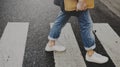 Young man wallking crosswalk commuter lifestyle