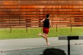 Young man warming up on the athletics track before training Royalty Free Stock Photo