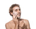 Young man washing face with soap on white Royalty Free Stock Photo