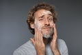 Young man washing face with soap Royalty Free Stock Photo