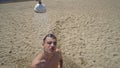 man washing hair under shower on beach Royalty Free Stock Photo