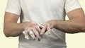 Young man washing his hands with soap foam to protect them from viruses and bacteries.