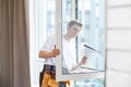 Young man washing window in office Royalty Free Stock Photo