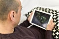 Young man watching a movie or a series in his tablet Royalty Free Stock Photo